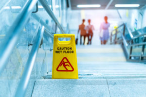 wet floor sign on stairs