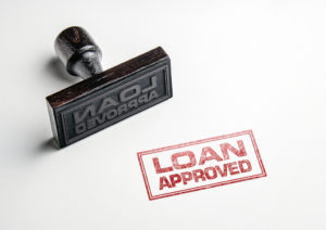 a-rubber-stamp-that-reads-loan-approved