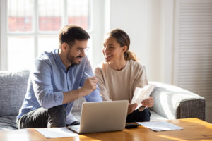 happy-couple-going-over-loan-paperwork