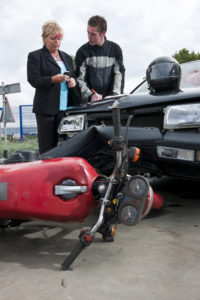 drivers conversing after a motorcycle accident