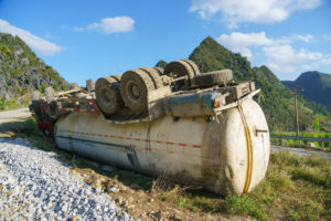 overturned truck carrying liquids