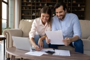 happy couple reviewing funding application