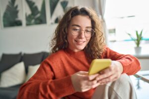 happy woman checking bank account