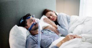 man using CPAP machine