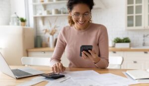 woman using charge card to pay bills