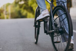 close-up on person riding bike