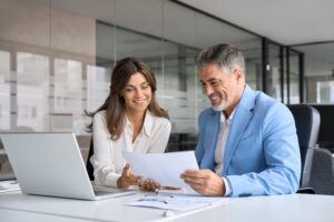 Two lawyers reviewing a pre-settlement funding request for support.