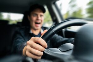 A rideshare driver, about to get into an accident. The other driver may be wondering what to do if they’re in an accident with a Lyft.