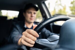 An Uber driver on his way to pick up a customer. What to do if you’re in an accident with an Uber.